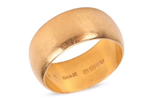 Lot 205 - A wide wedding band in 22ct gold, of D-profile...