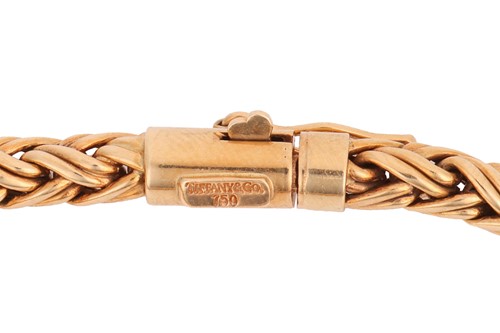 Lot 234 - Tiffany & Co. - A braided wheat link bracelet...