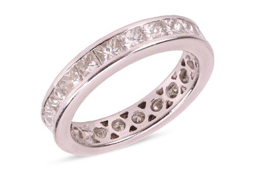 Lot 188 - A princess-cut diamond eternity ring,...