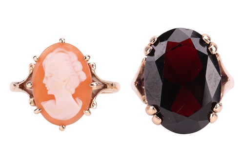 Lot 86 - A garnet dress ring in 9ct gold, size M½; and...