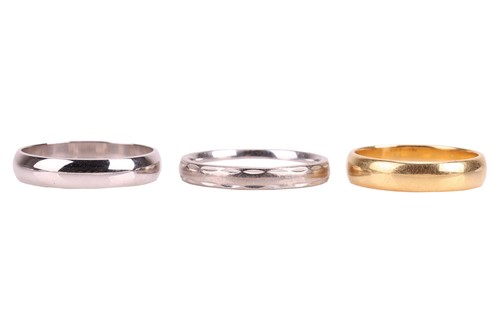 Lot 100 - Three gold wedding bands; two in 18ct gold,...