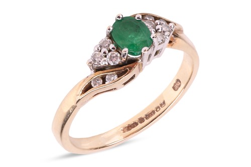 Lot 118 - An emerald and diamond dress ring in 9ct gold,...