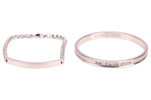 Lot 102 - Tiffany & Co. - a silver ID bracelet with...