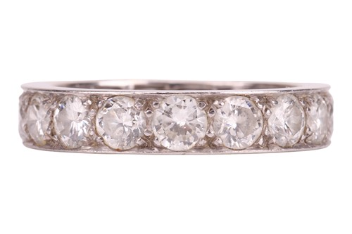 Lot A diamond eternity ring, claw-set with 17...