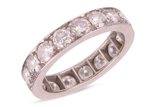 Lot A diamond eternity ring, claw-set with 17...