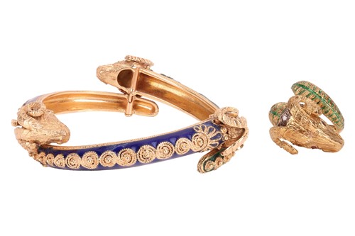 Lot 126 - A bangle and a ring of rams head motif design,...