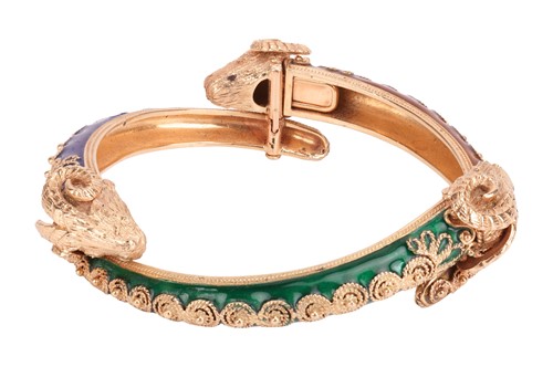 Lot 126 - A bangle and a ring of rams head motif design,...