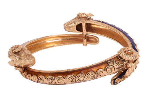Lot 126 - A bangle and a ring of rams head motif design,...
