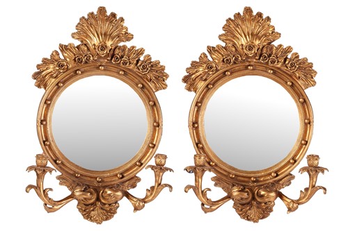 Lot 129 - A pair of Regency-style giltwood two-sconce...