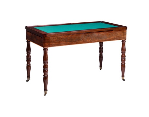 Lot 79 - A flame mahogany games table, 20th century,...