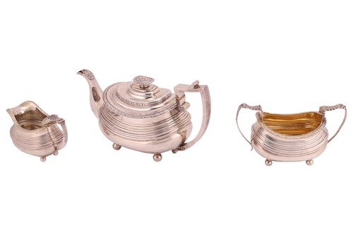 Lot 338 - A George III silver three-piece tea service,...