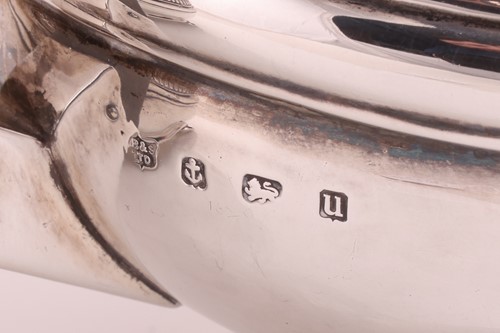 Lot A George V three-piece silver tea set,...