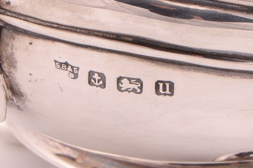 Lot A George V three-piece silver tea set,...