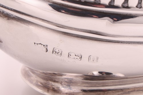 Lot A George V three-piece silver tea set,...