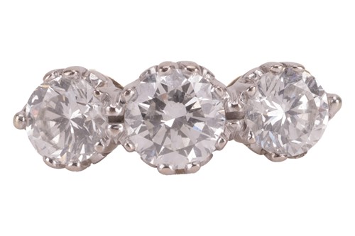 Lot A diamond three-stone ring, with an estimated...