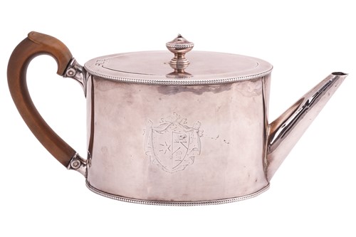 Lot A George III silver teapot of oval cylindrical...
