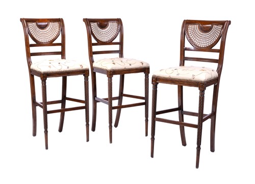 Lot 52 - A set of three beech wood bar stools by...