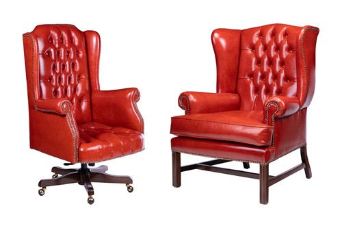 Lot 26 - A Chesterfield-style red leather wingback and...