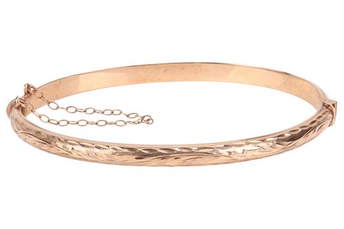 Lot 39 - A 9ct bangle, hollow, of hinged oval form,...