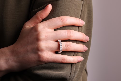 Lot An oval-cut diamond eternity ring, comprising...