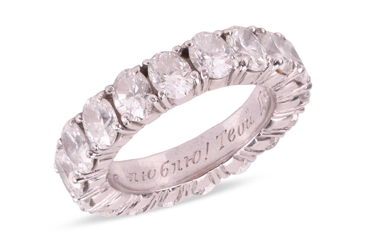 Lot An oval-cut diamond eternity ring, comprising...