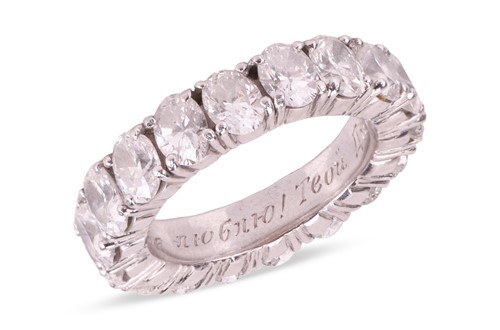 Lot An oval-cut diamond eternity ring, comprising...