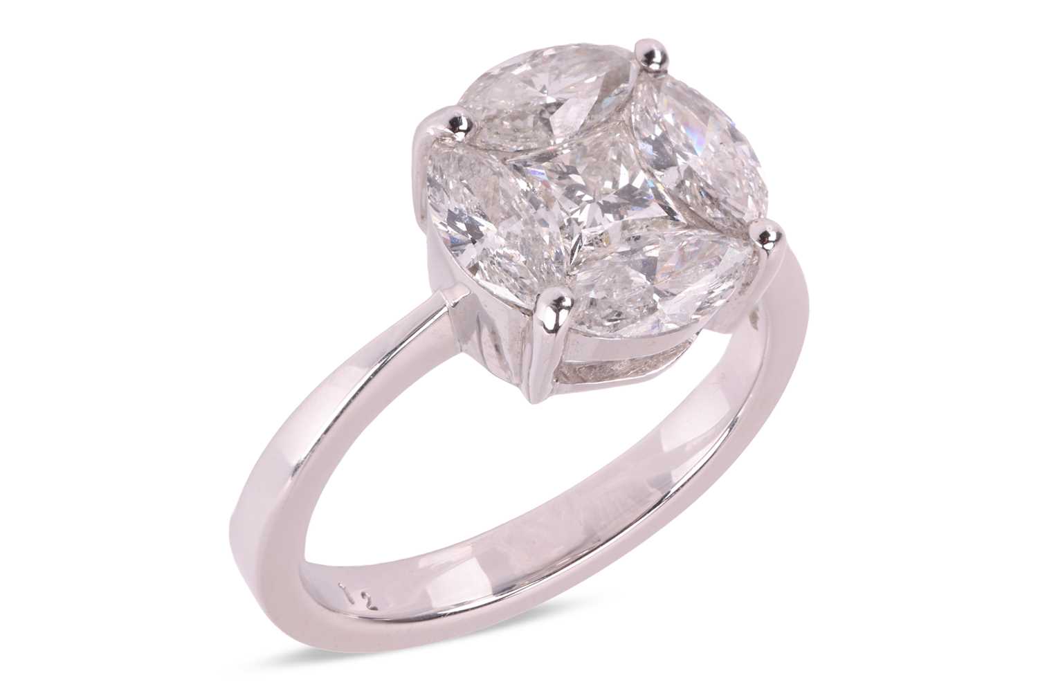 Lot A diamond cluster ring, illusion-set with a...