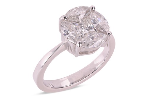 Lot A diamond cluster ring, illusion-set with a...