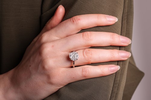 Lot A diamond cluster ring, illusion-set with a...
