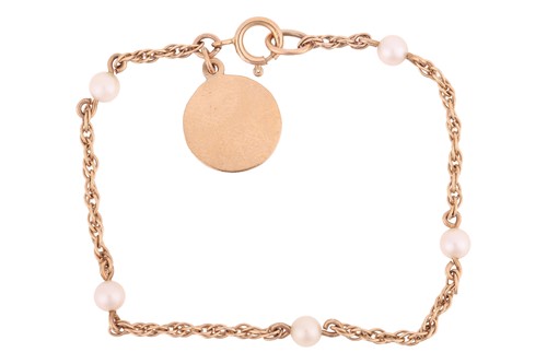 Lot 10 - A pearl-set christening bracelet, the twist...