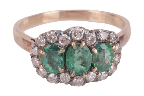 Lot An emerald and diamond cluster ring, composed...