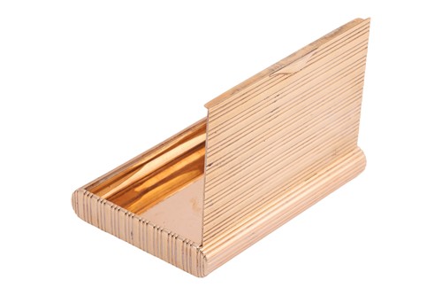 Lot A cigarette case in 14ct gold, of reeded...