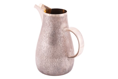 Lot Gerald Benney - a silver water jug, of...