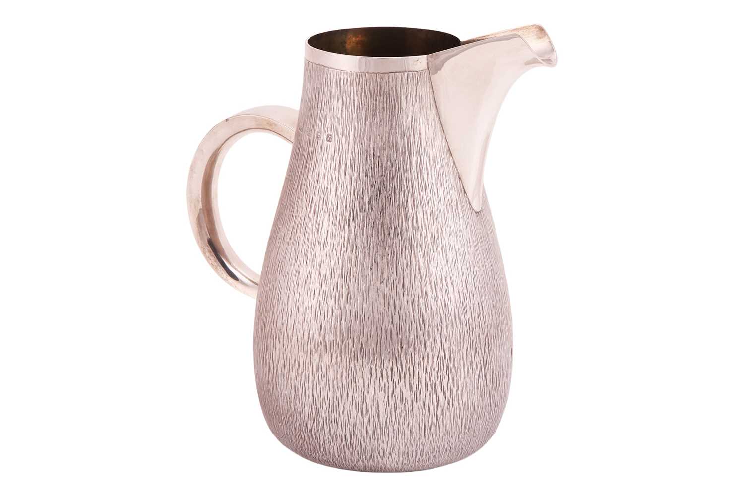 Lot Gerald Benney - a silver water jug, of...