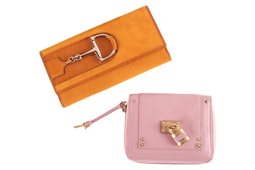 Lot 331 - A Gucci horsebit purse in yellow suede leather,...
