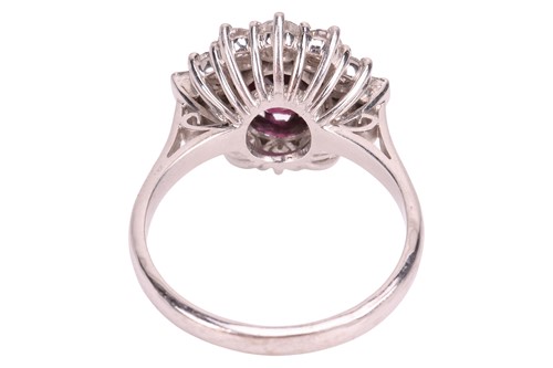Lot A ruby and diamond cluster ring, centred with...