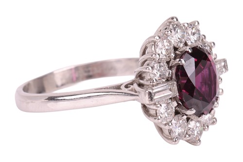 Lot A ruby and diamond cluster ring, centred with...