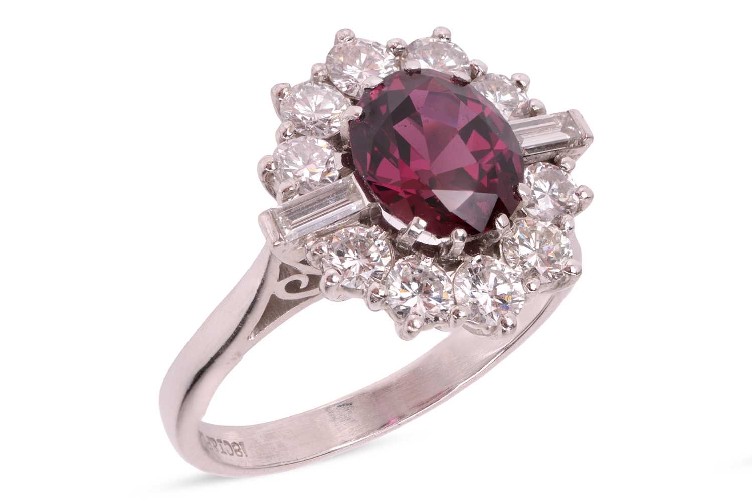 Lot A ruby and diamond cluster ring, centred with...