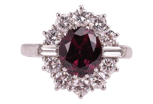 Lot A ruby and diamond cluster ring, centred with...