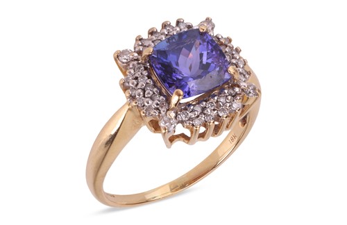 Lot A tanzanite and diamond cluster ring, the four-...