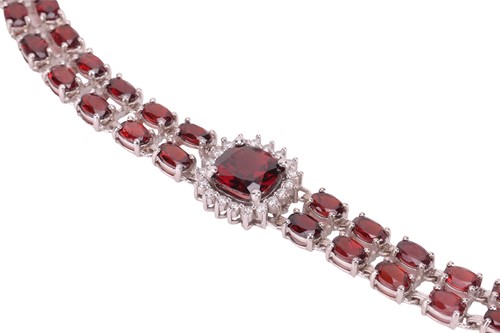 Lot A garnet and diamond collar necklace, composed...