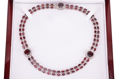 Lot A garnet and diamond collar necklace, composed...