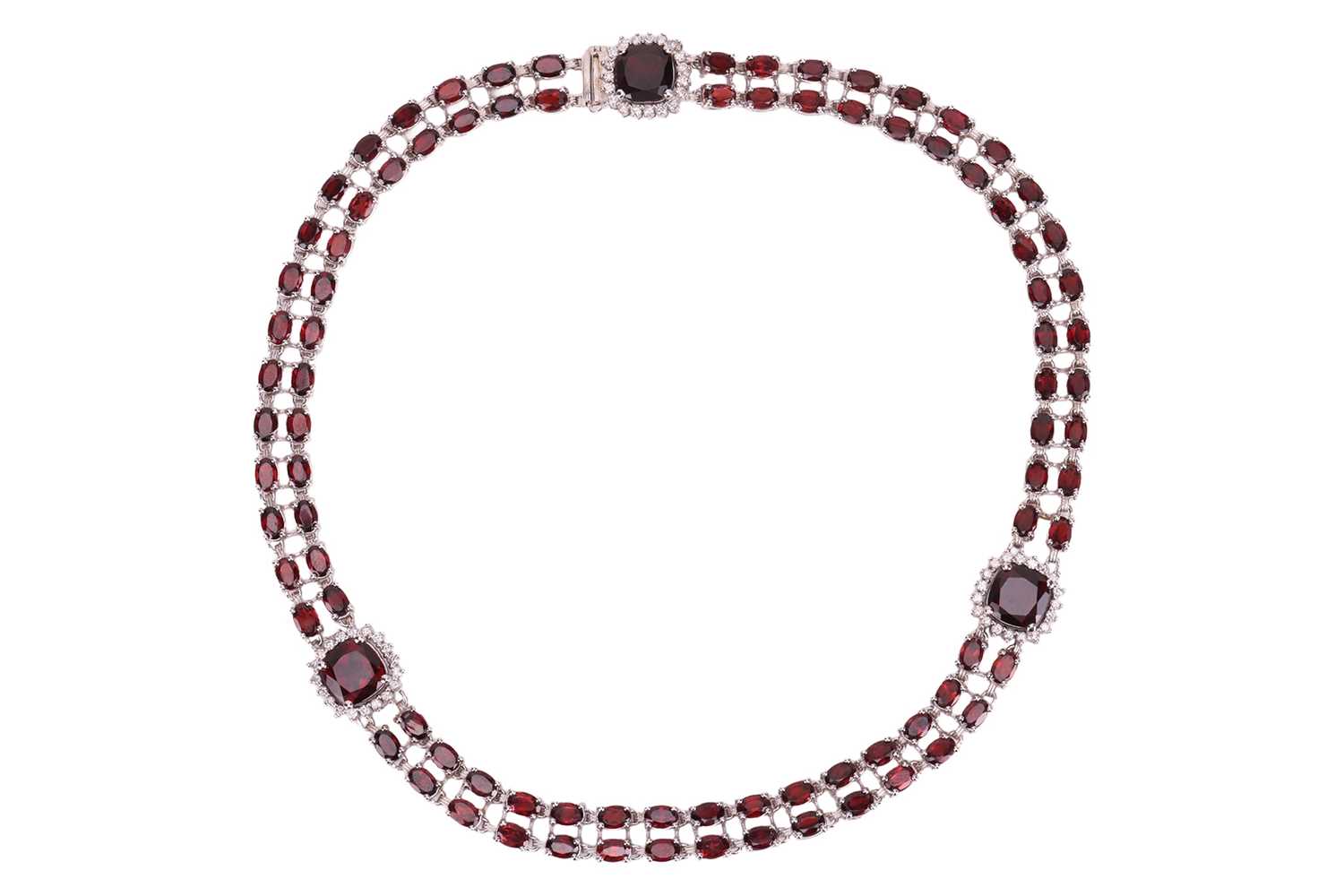Lot A garnet and diamond collar necklace, composed...