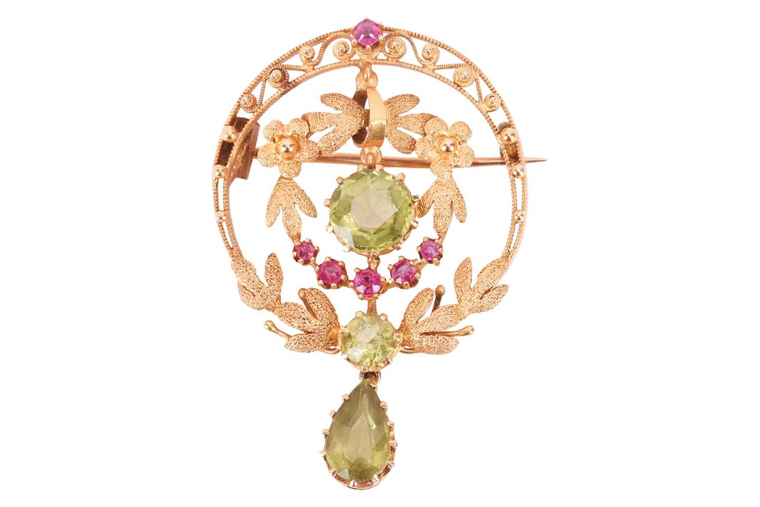 Lot A ruby and peridot brooch, of circular foliate...
