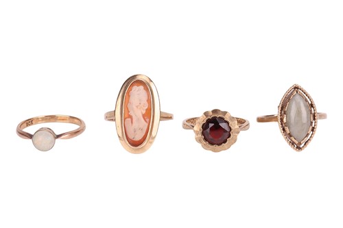 Lot 58 - A group of four gem-set rings; including an...