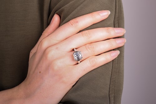 Lot An emerald-cut diamond dress ring, featuring...
