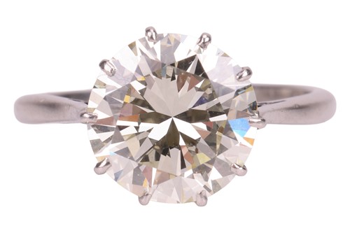 Lot A round brilliant-cut diamond solitaire ring,...