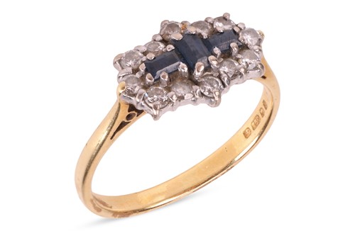Lot 64 - A sapphire and diamond cluster ring, the three...