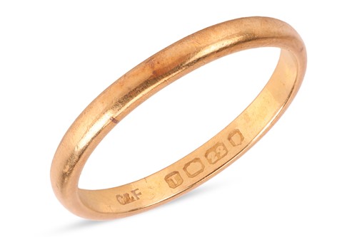 Lot 47 - A 22ct gold band ring, stamped with London...