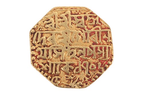 Lot 273 - An octagonal Mohur coin, 11.2 grams.
